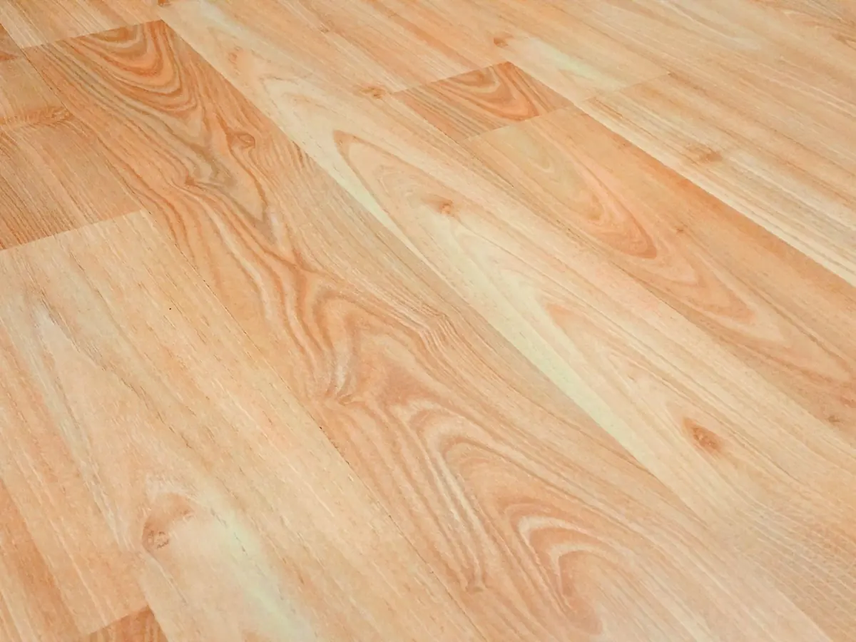 Detailed wooden floor texture background showcasing natural wood grain and patterns for design use.