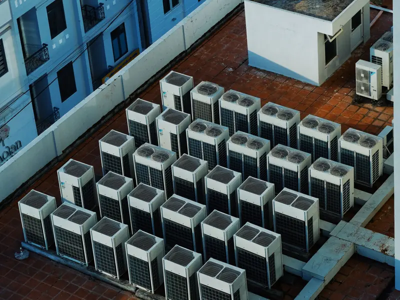 High angle view of rooftop HVAC units on a building in Buon Ma Thuot, Vietnam.
