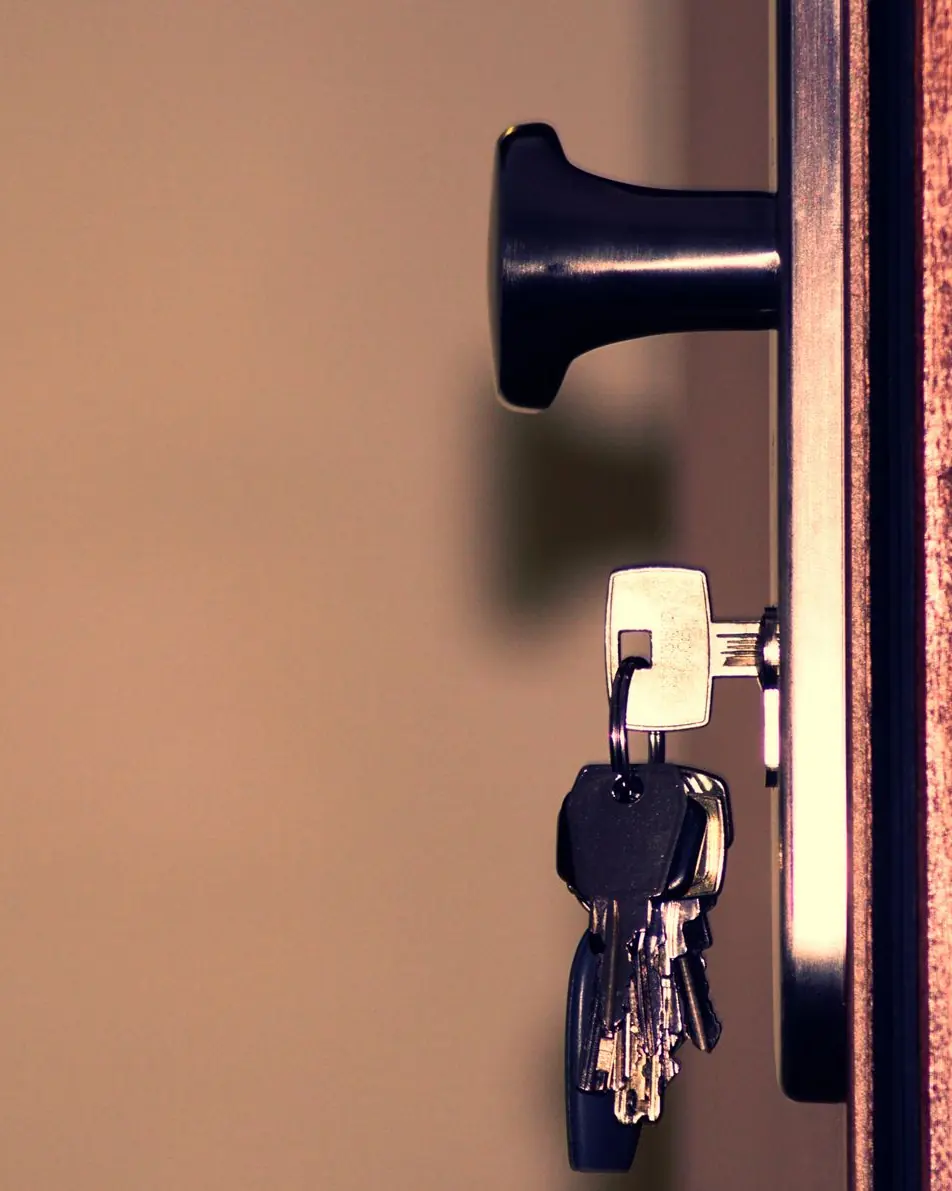 Detailed view of a door lock and keys emphasizing security and access.