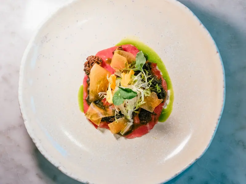 Exquisite gourmet dish on elegant plate showcasing fine dining artistry.