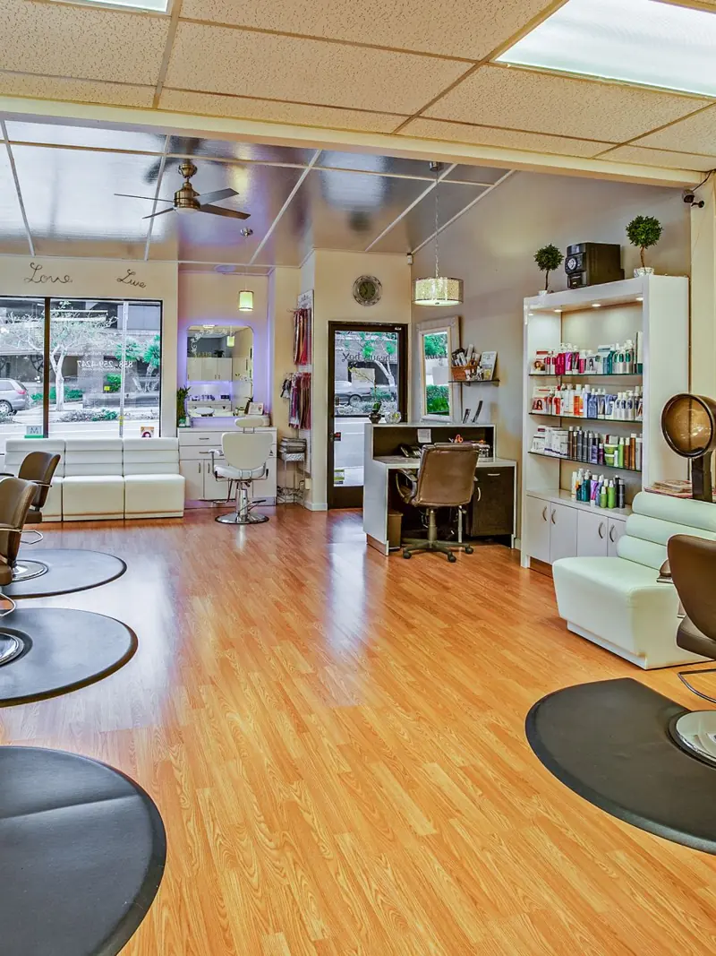 Spacious hair salon in Del Mar, California featuring contemporary design and ample seating.